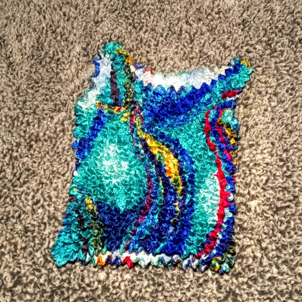 Multi Colored shirt it is very stretchy and one size fits most.